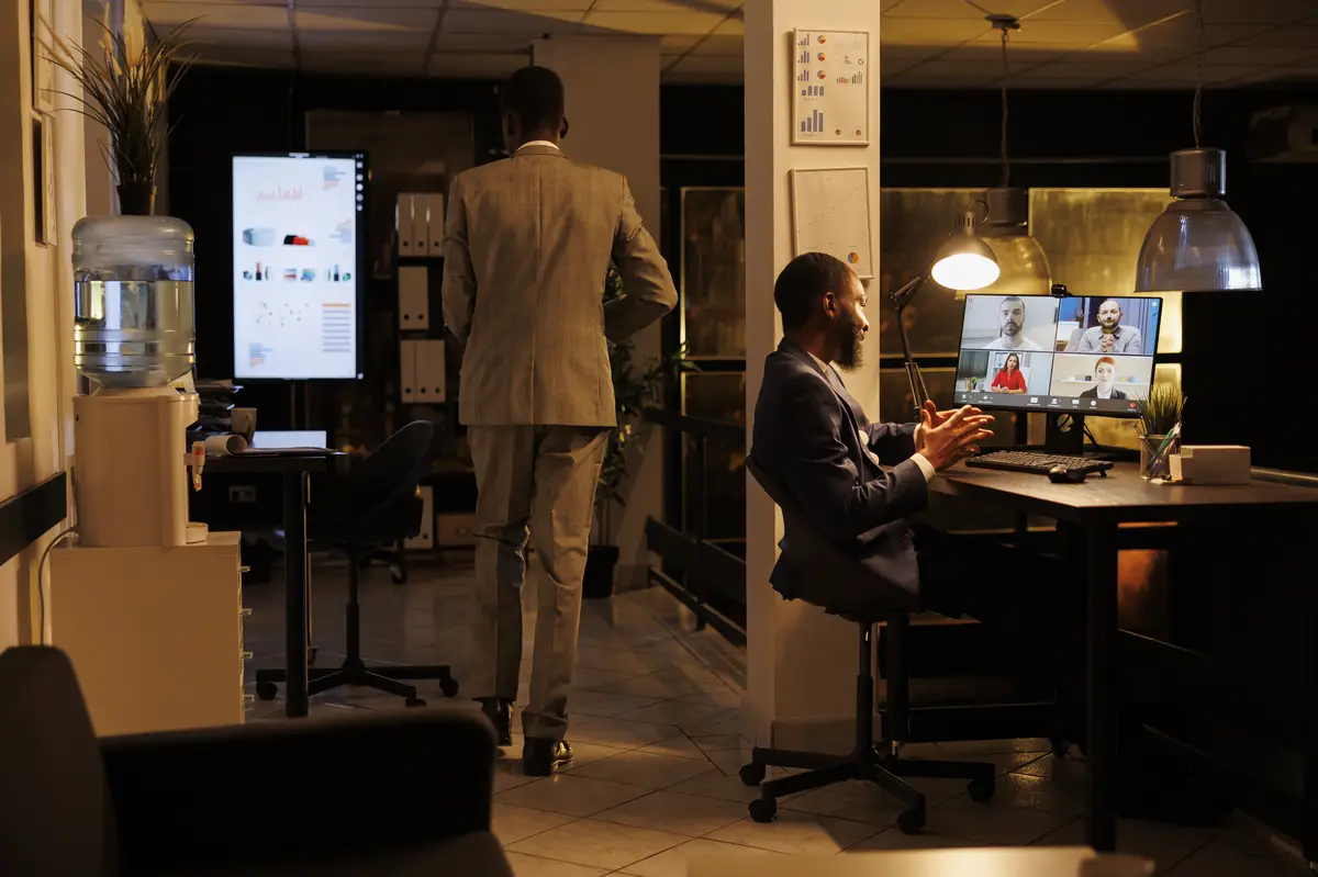 Entrepreneur having remote discussion with company team